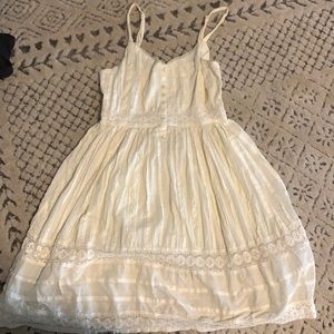 Cream colored used XS shirt in great condition